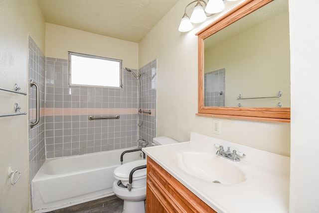 full bath featuring toilet, shower / bathing tub combination, vanity, and a textured ceiling