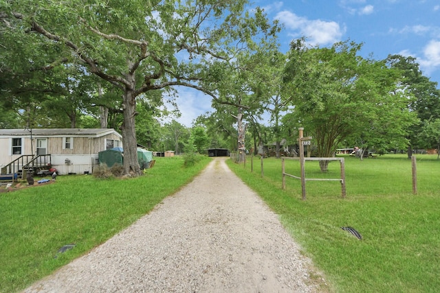 8335 Jernigan Rd, Conroe, TX 77306 - view of property's community featuring a lawn and driveway