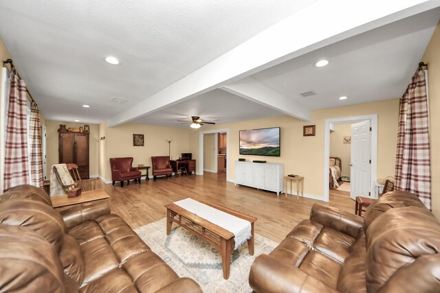 8335 Jernigan Rd, Conroe, TX 77306 - living room with beam ceiling, light wood-style flooring, a ceiling fan, baseboards, and recessed lighting