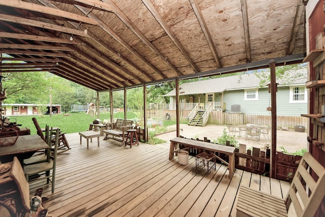 8335 Jernigan Rd, Conroe, TX 77306 - deck with fence, outdoor dining space, and a yard