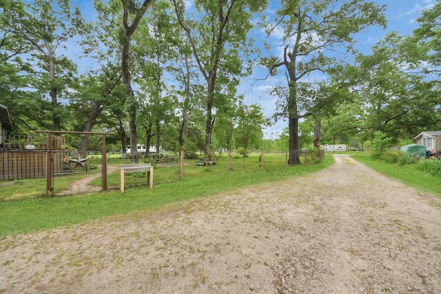 8335 Jernigan Rd, Conroe, TX 77306 - exterior space with dirt driveway