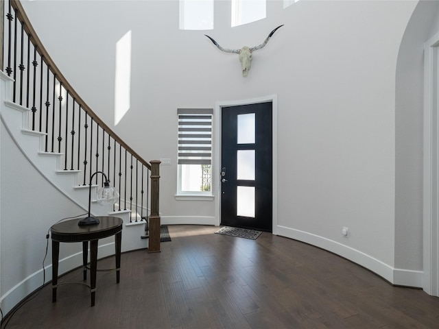 19103 Timpson Dr, Cypress, TX 77433 - entryway featuring baseboards, a high ceiling, wood finished floors, stairway, and arched walkways