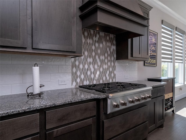 19103 Timpson Dr, Cypress, TX 77433 - kitchen with stainless steel gas stovetop, premium range hood, dark wood-style floors, and plenty of natural light