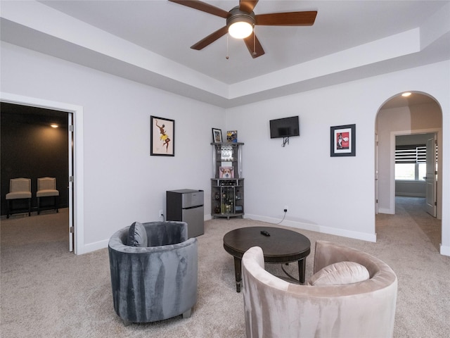 19103 Timpson Dr, Cypress, TX 77433 - living area featuring light carpet, a ceiling fan, arched walkways, and baseboards