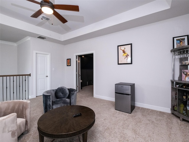 19103 Timpson Dr, Cypress, TX 77433 - carpeted living room with a raised ceiling, ceiling fan, and baseboards
