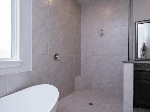19103 Timpson Dr, Cypress, TX 77433 - bathroom featuring a tile shower, a soaking tub, and vanity