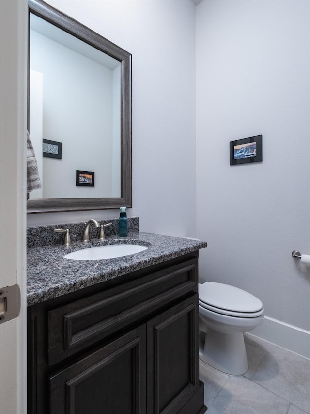 19103 Timpson Dr, Cypress, TX 77433 - half bath with vanity, tile patterned flooring, toilet, and baseboards