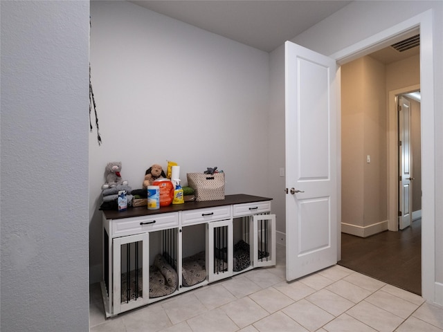 19103 Timpson Dr, Cypress, TX 77433 - bar featuring light tile patterned floors and baseboards