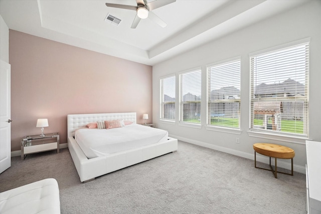 29035 Nectar Island Ln, Katy, TX 77494 - carpeted bedroom featuring a raised ceiling, baseboards, and ceiling fan