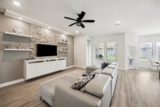29035 Nectar Island Ln, Katy, TX 77494 - living room featuring light wood finished floors, healthy amount of natural light, a ceiling fan, recessed lighting, and baseboards