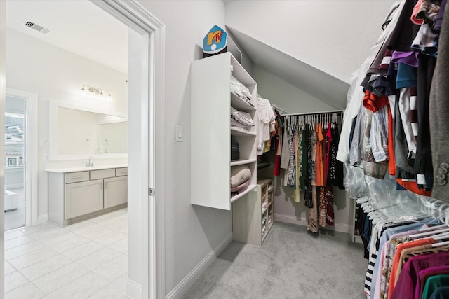 29035 Nectar Island Ln, Katy, TX 77494 - spacious closet with a sink and light tile patterned flooring