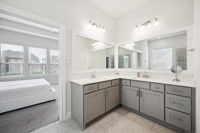 29035 Nectar Island Ln, Katy, TX 77494 - ensuite bathroom with tile patterned flooring, double vanity, healthy amount of natural light, and a tile shower