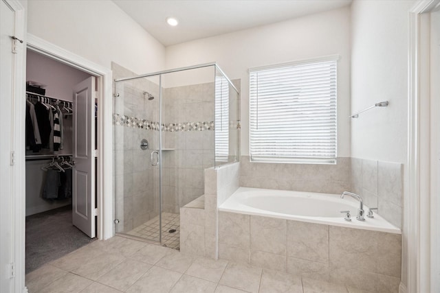 29035 Nectar Island Ln, Katy, TX 77494 - bathroom with a bath, a stall shower, tile patterned flooring, a walk in closet, and recessed lighting
