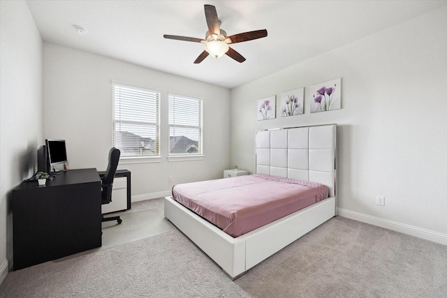 29035 Nectar Island Ln, Katy, TX 77494 - bedroom with carpet floors, baseboards, ceiling fan, and a desk