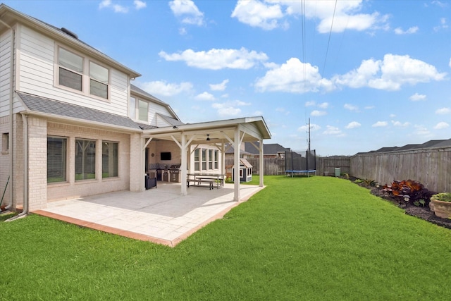 29035 Nectar Island Ln, Katy, TX 77494 - view of yard featuring a trampoline, a patio area, and a ceiling fan