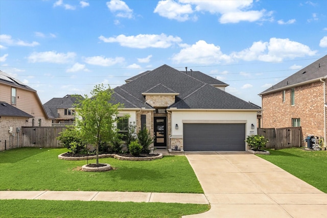 29035 Nectar Island Ln, Katy, TX 77494 - french country inspired facade featuring a garage, concrete driveway, stucco siding, a shingled roof, and stone siding