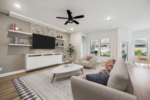 29035 Nectar Island Ln, Katy, TX 77494 - living area featuring light wood-style floors, ceiling fan, baseboards, and recessed lighting