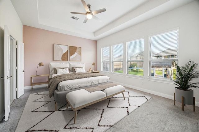 29035 Nectar Island Ln, Katy, TX 77494 - bedroom featuring a raised ceiling, carpet flooring, and baseboards
