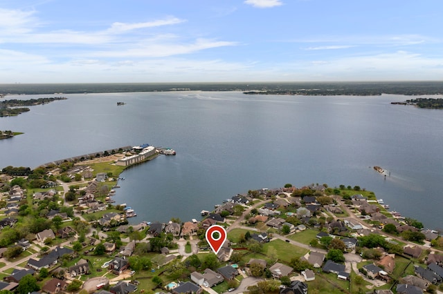 drone / aerial view with a water view and a residential view