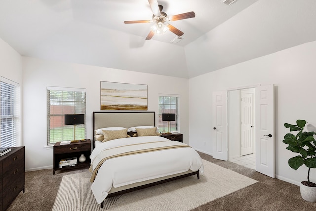 carpeted bedroom featuring high vaulted ceiling, baseboards, a ceiling fan, and visible vents