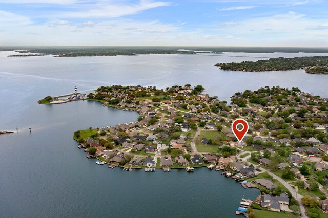 drone / aerial view with a water view and a residential view