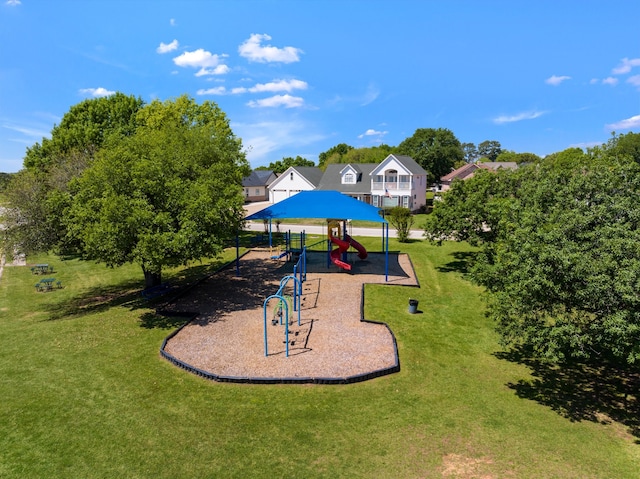 community play area featuring a lawn