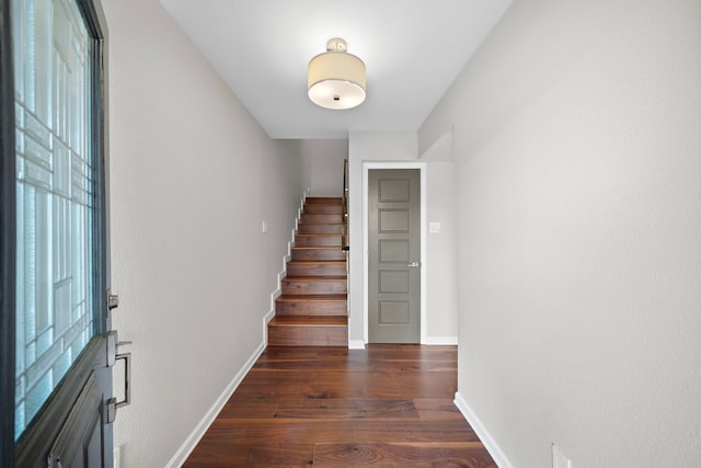 8954 Chatsworth Dr, Houston, TX 77024 - foyer featuring stairs, dark wood-style flooring, and baseboards