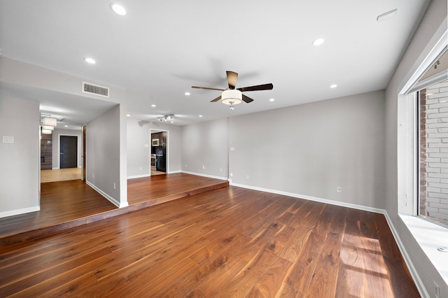 8954 Chatsworth Dr, Houston, TX 77024 - unfurnished living room with ceiling fan, wood finished floors, recessed lighting, and baseboards