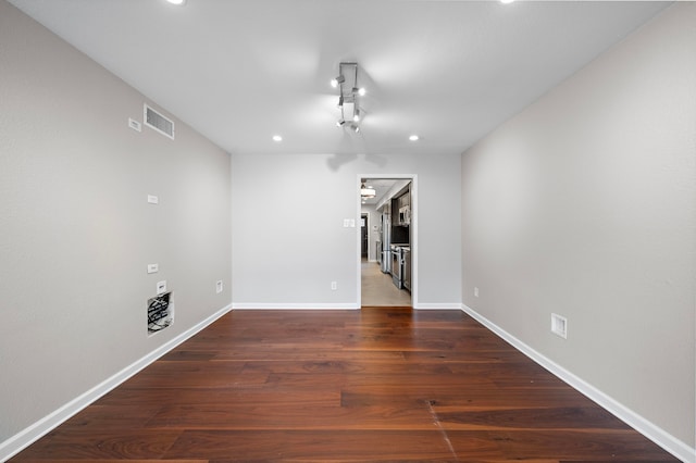 8954 Chatsworth Dr, Houston, TX 77024 - empty room with recessed lighting, baseboards, and wood finished floors
