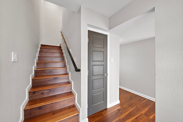 8954 Chatsworth Dr, Houston, TX 77024 - stairway featuring wood finished floors and baseboards