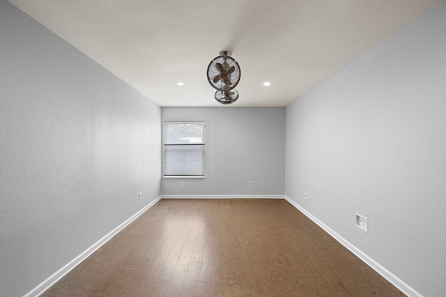 8954 Chatsworth Dr, Houston, TX 77024 - empty room featuring baseboards, recessed lighting, and dark wood-type flooring