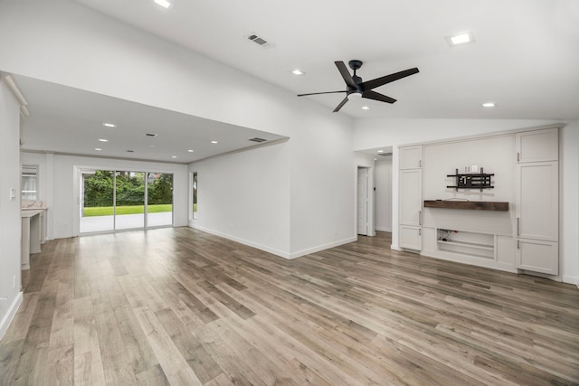 4626 Ella Blvd, Houston, TX 77018 - unfurnished living room featuring ceiling fan, light wood-style flooring, recessed lighting, lofted ceiling, and baseboards