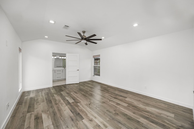 4626 Ella Blvd, Houston, TX 77018 - unfurnished bedroom featuring recessed lighting, dark wood-style flooring, vaulted ceiling, baseboards, and ensuite bathroom