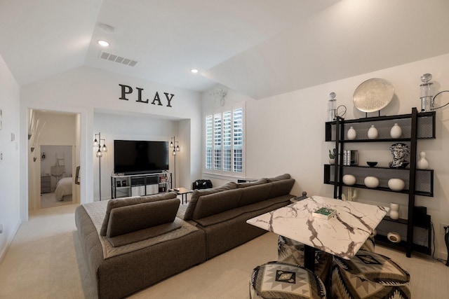 2514 Heritage Park Dr, Missouri City, TX 77459 - living area featuring visible vents, vaulted ceiling, and light carpet