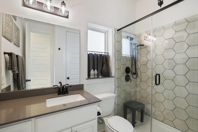 2514 Heritage Park Dr, Missouri City, TX 77459 - full bathroom featuring toilet, a stall shower, and vanity