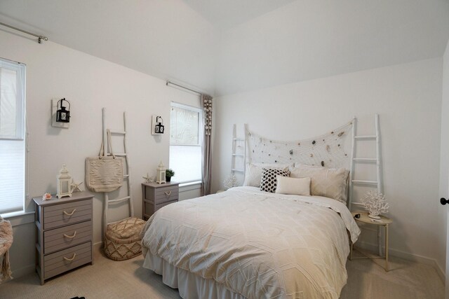 2514 Heritage Park Dr, Missouri City, TX 77459 - bedroom featuring light colored carpet, vaulted ceiling, and baseboards