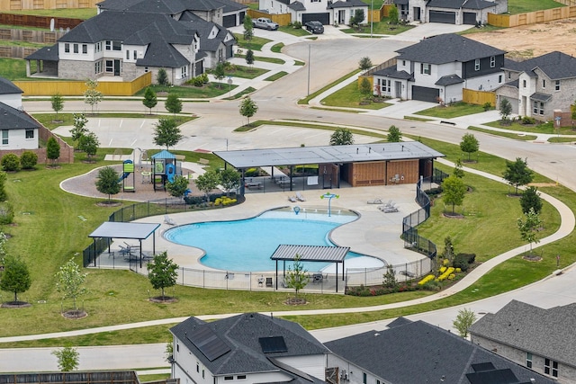 birds eye view of property with a residential view