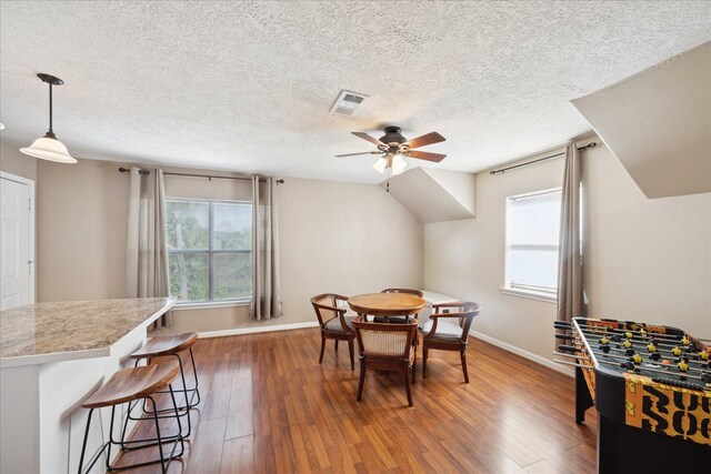3650 Ward Bend Rd, Sealy, TX 77474 - dining space with baseboards, a textured ceiling, a ceiling fan, visible vents, and hardwood / wood-style flooring