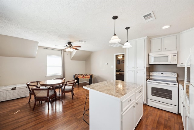 3650 Ward Bend Rd, Sealy, TX 77474 - kitchen with white appliances, a textured ceiling, a ceiling fan, a kitchen island, and visible vents