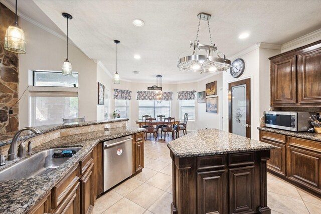 3650 Ward Bend Rd, Sealy, TX 77474 - kitchen with light tile patterned floors, pendant lighting, a sink, and appliances with stainless steel finishes