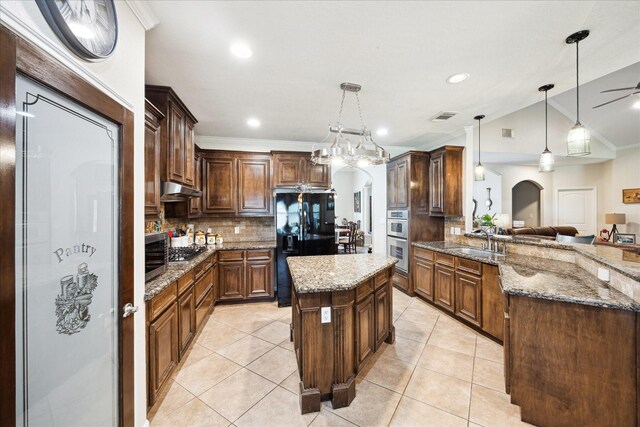 3650 Ward Bend Rd, Sealy, TX 77474 - kitchen with visible vents, arched walkways, a sink, appliances with stainless steel finishes, and under cabinet range hood