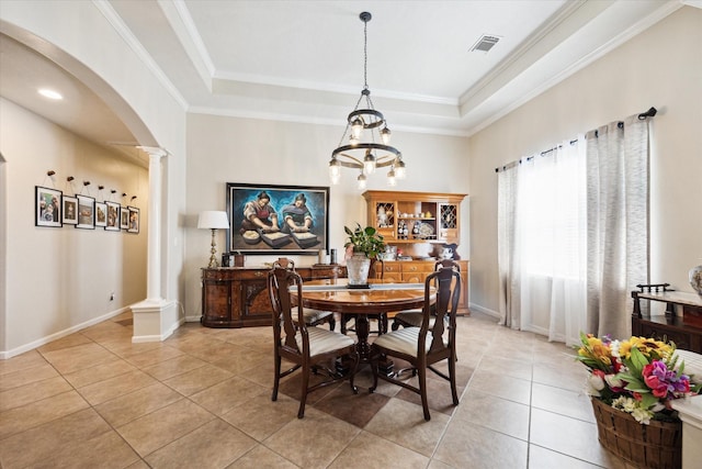 3650 Ward Bend Rd, Sealy, TX 77474 - dining area featuring visible vents, a raised ceiling, arched walkways, decorative columns, and light tile patterned flooring