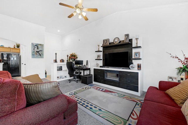 living area with light carpet, a ceiling fan, and lofted ceiling