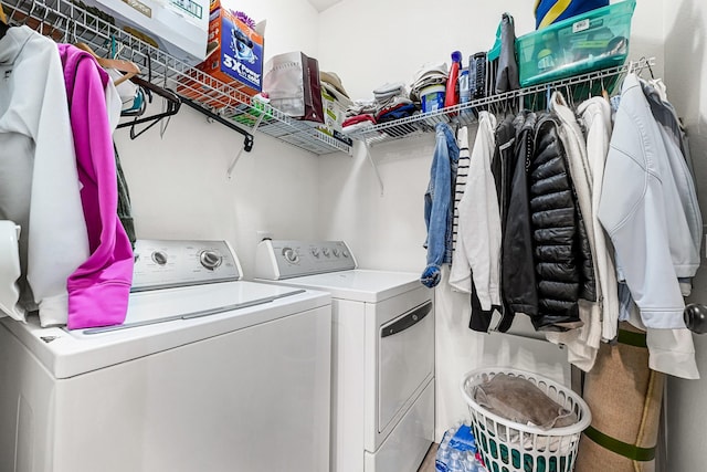 washroom featuring washer and dryer and laundry area