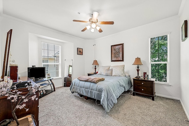 bedroom with a ceiling fan, light carpet, baseboards, and ornamental molding