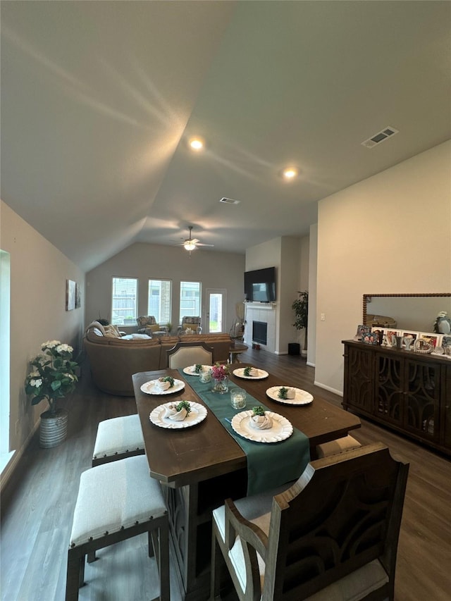 835 Sarasota Shore Dr, Katy, TX 77493 - dining room with wood finished floors, ceiling fan, baseboards, lofted ceiling, and visible vents