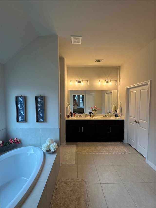 835 Sarasota Shore Dr, Katy, TX 77493 - bathroom with a garden tub, vanity, tile patterned floors, and visible vents