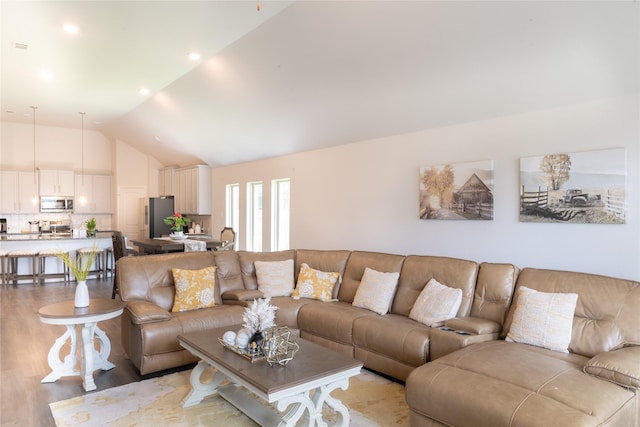835 Sarasota Shore Dr, Katy, TX 77493 - living area with vaulted ceiling and light wood finished floors