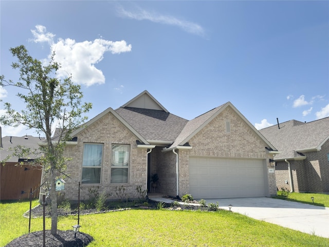 835 Sarasota Shore Dr, Katy, TX 77493 - view of front facade with an attached garage, concrete driveway, brick siding, a front yard, and roof with shingles