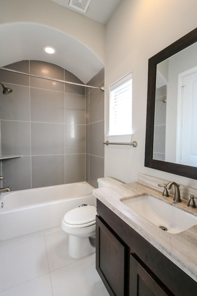 bathroom featuring shower / washtub combination, vanity, visible vents, toilet, and tile patterned floors
